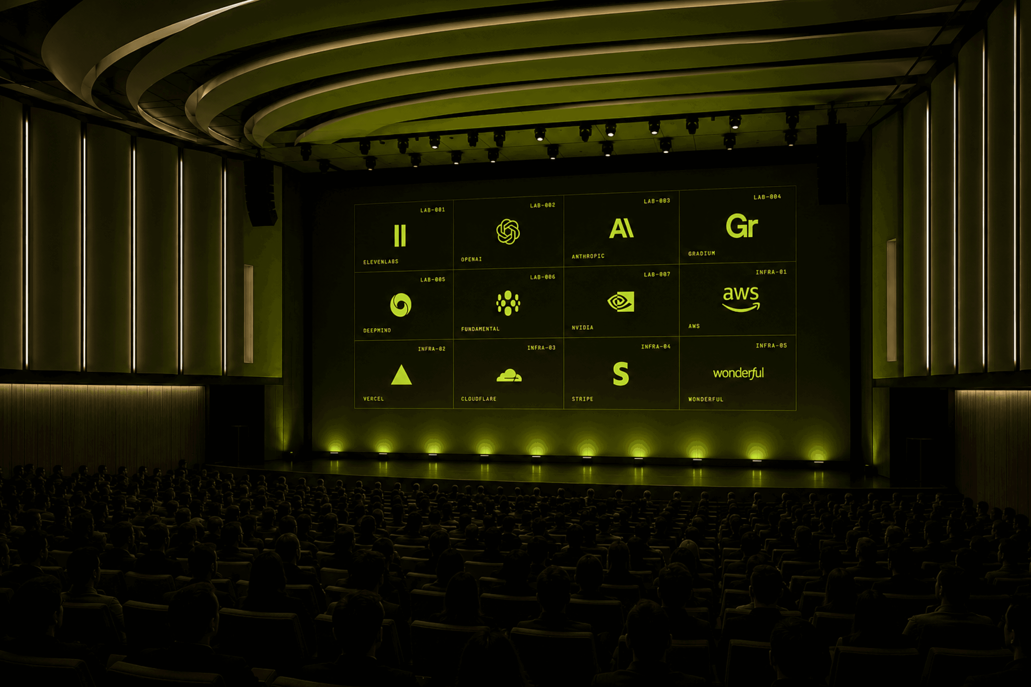 Auditorium stage at Off the Radar with a wall-sized grid of the participating labs and infrastructure partners.